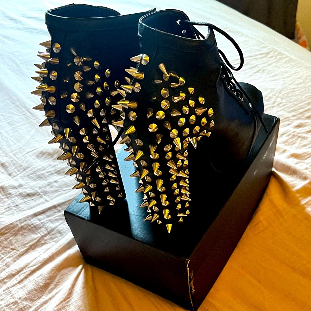 Spiked high heel boots